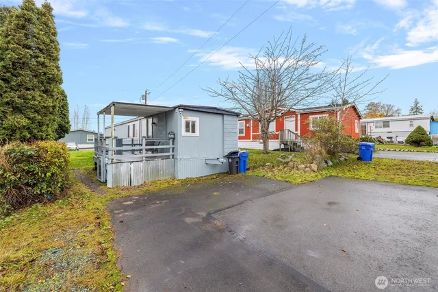 a balcony with chairs and wooden floor