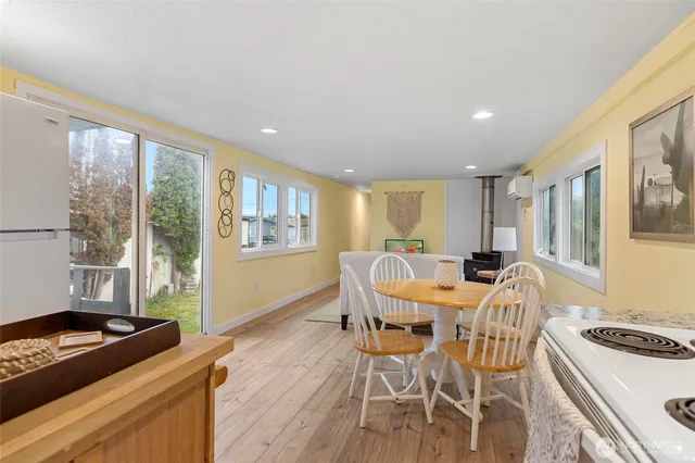 a view of a dining room with furniture window and outside view