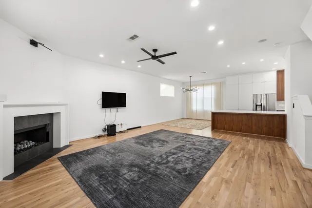 a living room with a couch and a fireplace