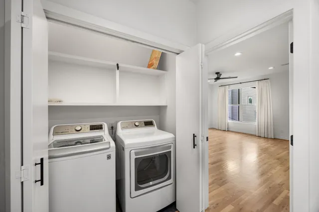 a view of storage and utility room with washer and dryer