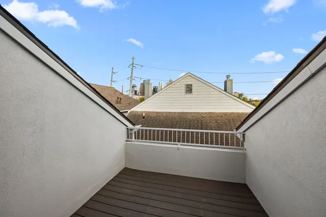 a view of balcony with wooden floor