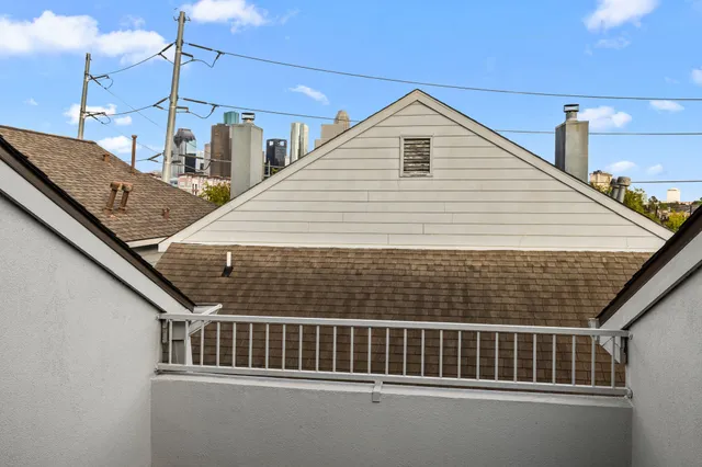 a view of balcony with a ceiling fan