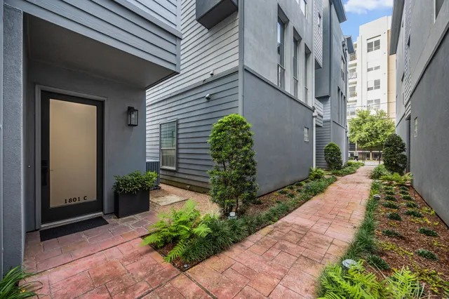a view of a pathway both side of the house