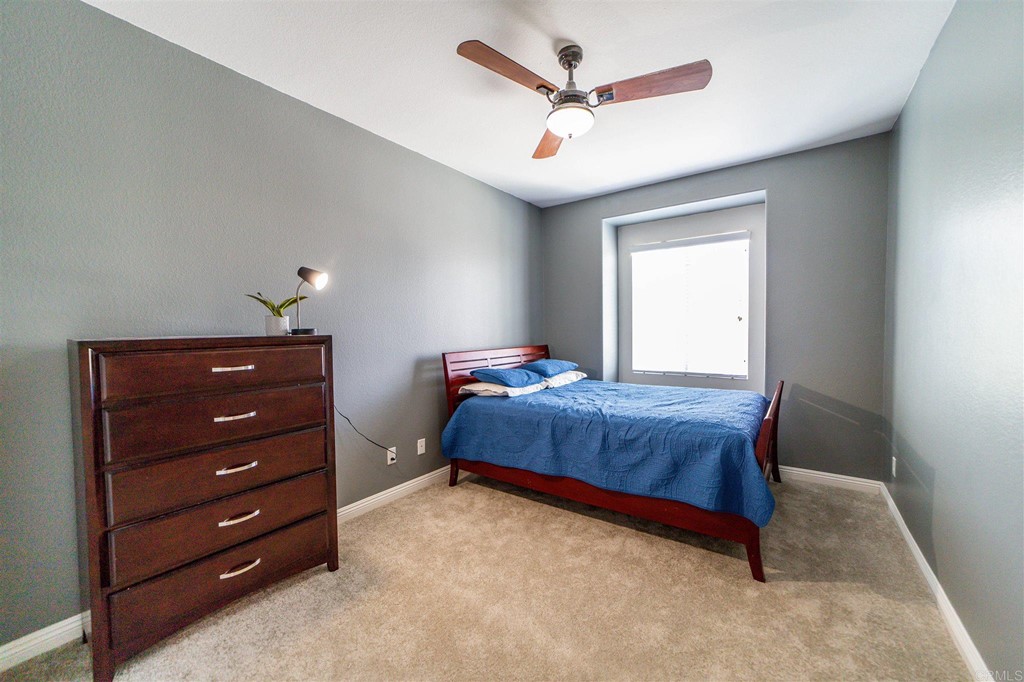 31047 Rose Circle Murrieta, CA 92563 - Photo 11 of 20 a bedroom with a bed and a dresser