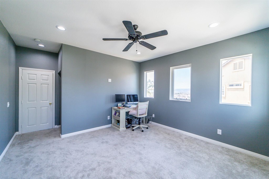 31047 Rose Circle Murrieta, CA 92563 - Photo 15 of 20 a workspace with chandelier fan and windows