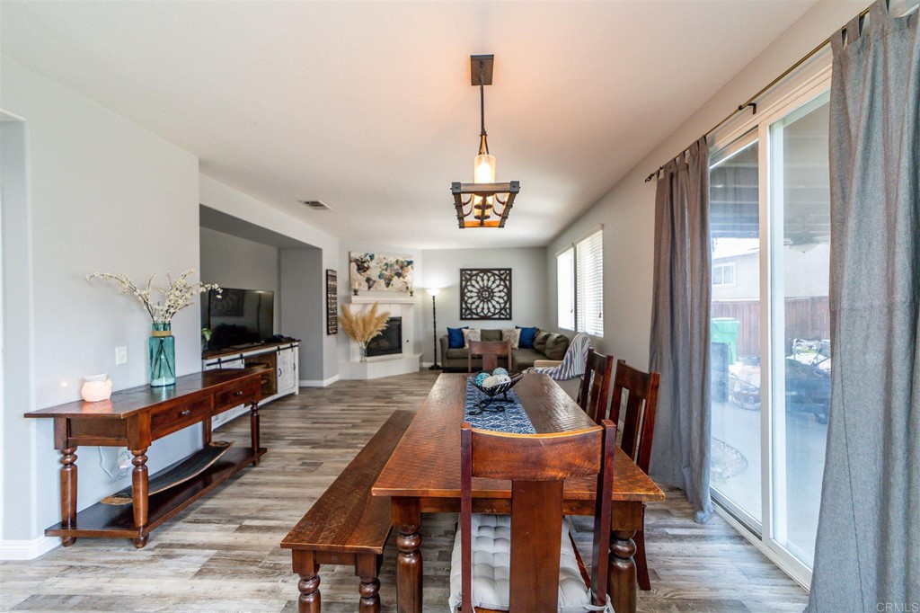 31047 Rose Circle Murrieta, CA 92563 - Photo 6 of 20 a view of a dining room with furniture window and wooden floor