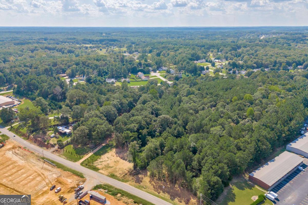 755 Harry McCarty Road Bethlehem, GA 30620 - Photo 13 of 28 an aerial view of residential houses with outdoor space and trees