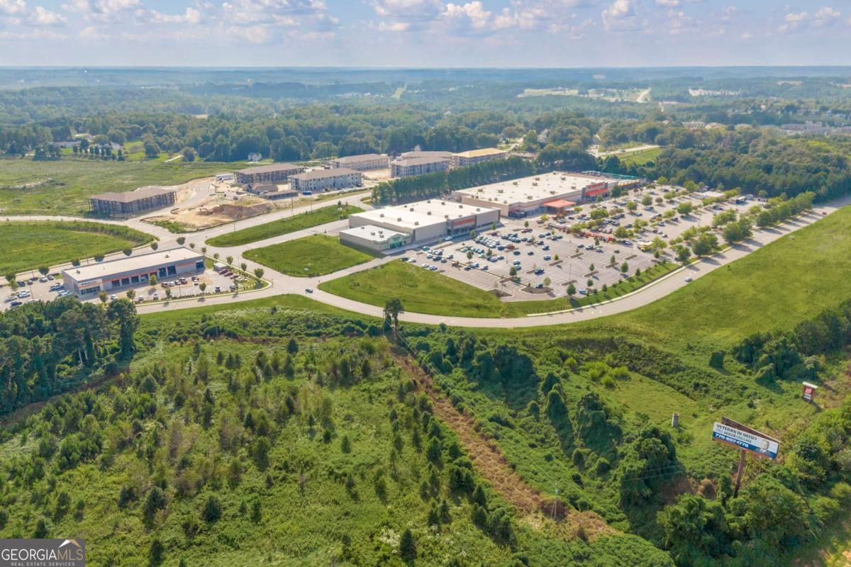755 Harry McCarty Road Bethlehem, GA 30620 - Photo 27 of 28 a view of a lake with a mountain in the background