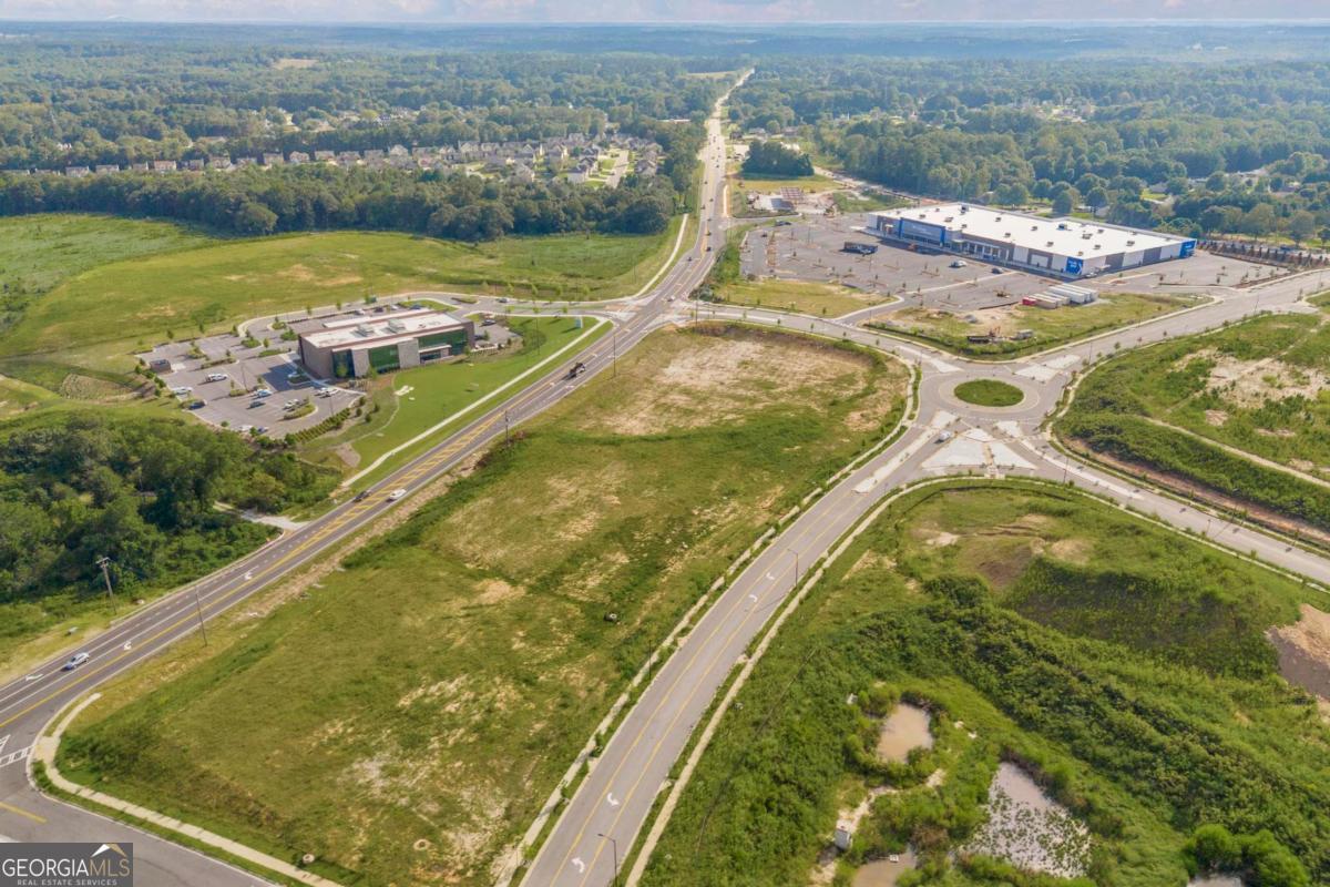 755 Harry McCarty Road Bethlehem, GA 30620 - Photo 28 of 28 an aerial view of residential houses with outdoor space