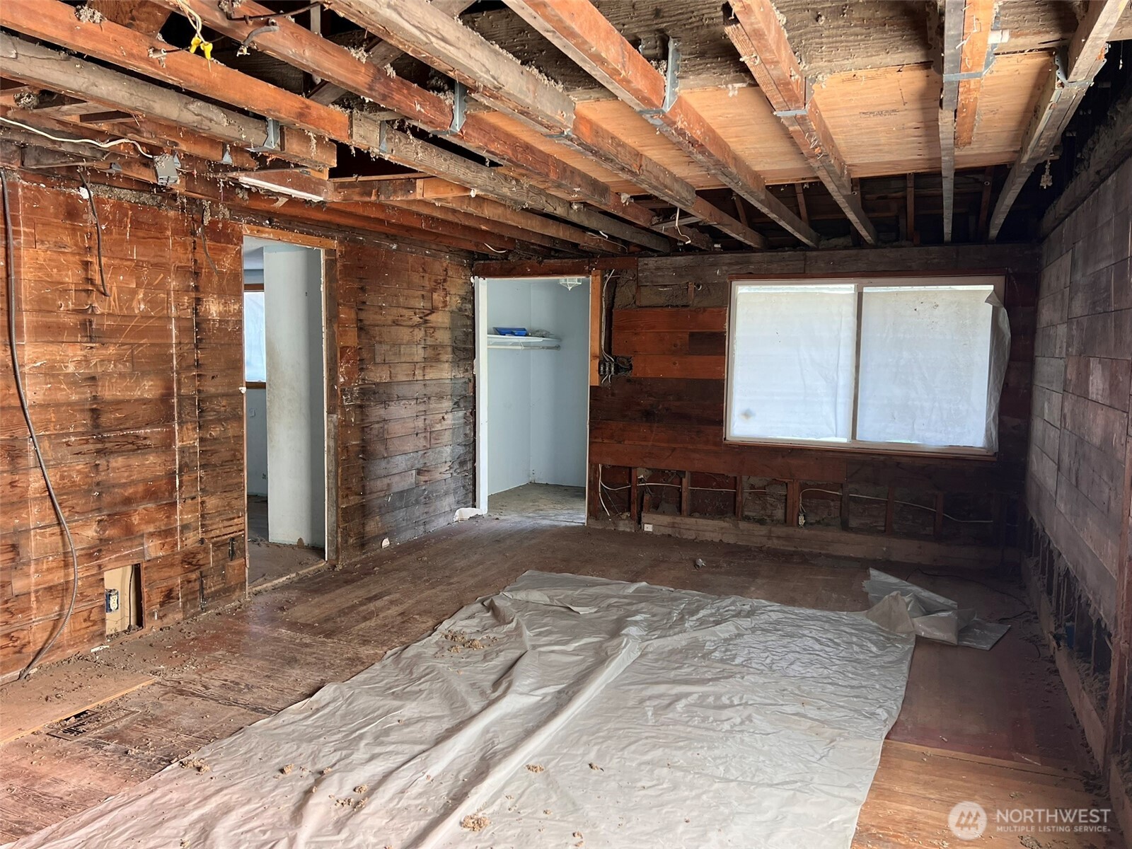10049 8th Avenue Southwest Seattle, WA 98146 - Photo 16 of 20 a view of a room with wooden floor and windows