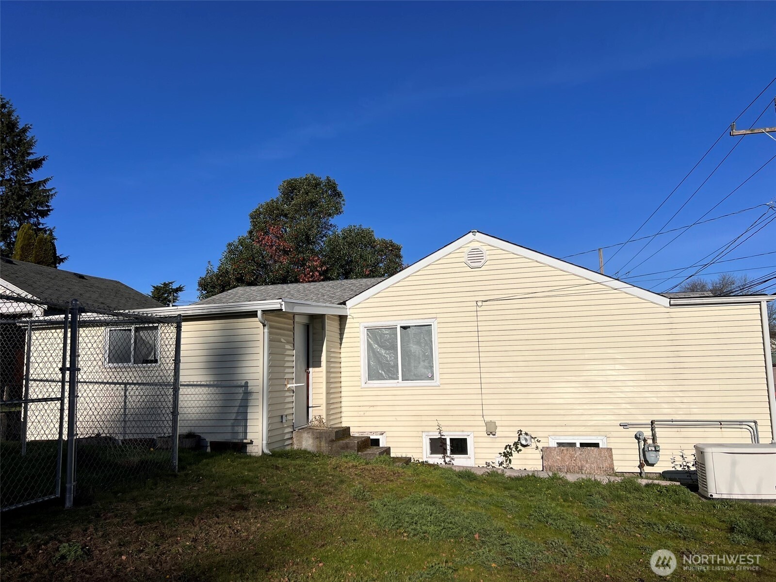 10049 8th Avenue Southwest Seattle, WA 98146 - Photo 5 of 20 a view of a house with a yard