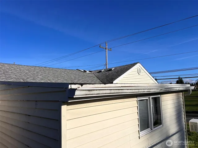 a view of a swimming pool with an outdoor seating and a yard