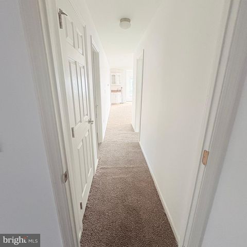a view of a bathroom with sink and mirror