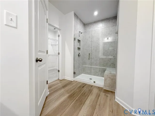 a bathroom with a bathtub and shower