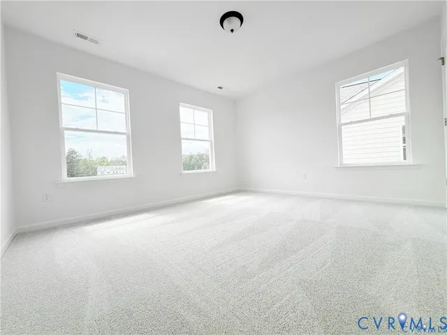 an empty room with windows