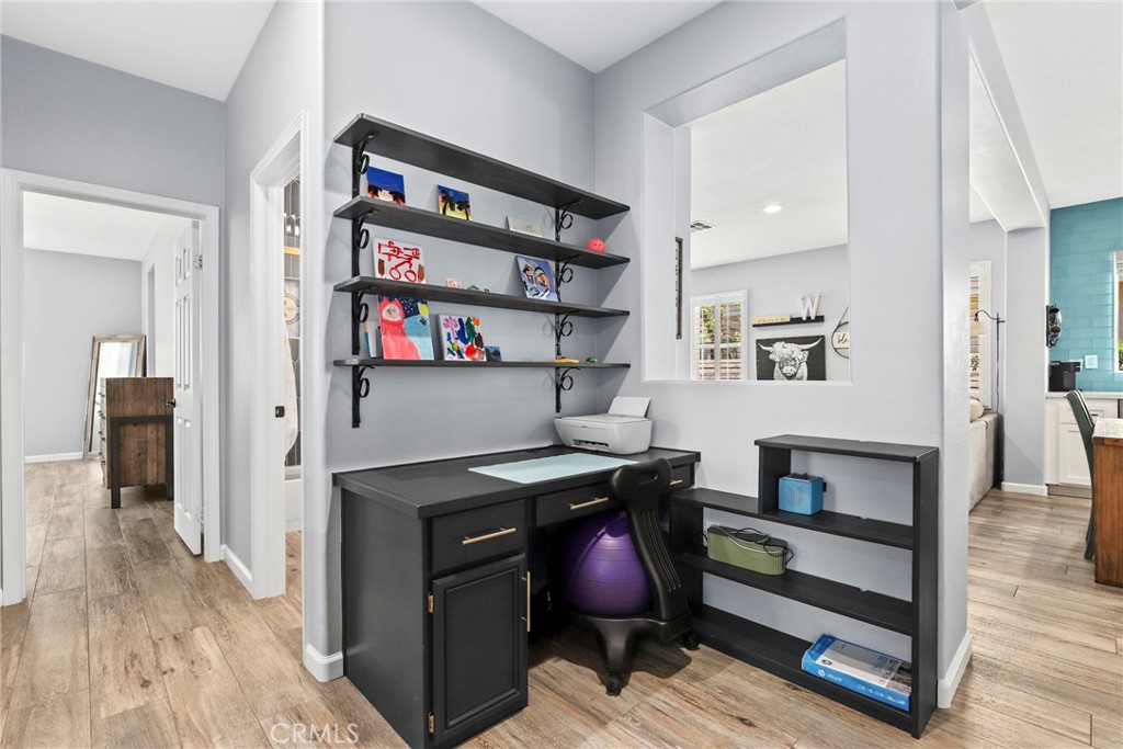 19735 Edmonds Place Saugus, CA 91350 - Photo 12 of 34 a view of a workspace with furniture and wooden floor