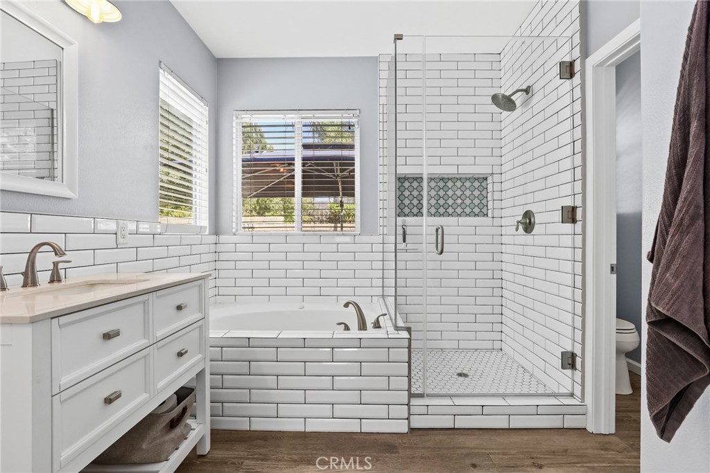 19735 Edmonds Place Saugus, CA 91350 - Photo 18 of 34 a bathroom with a shower sink and mirror