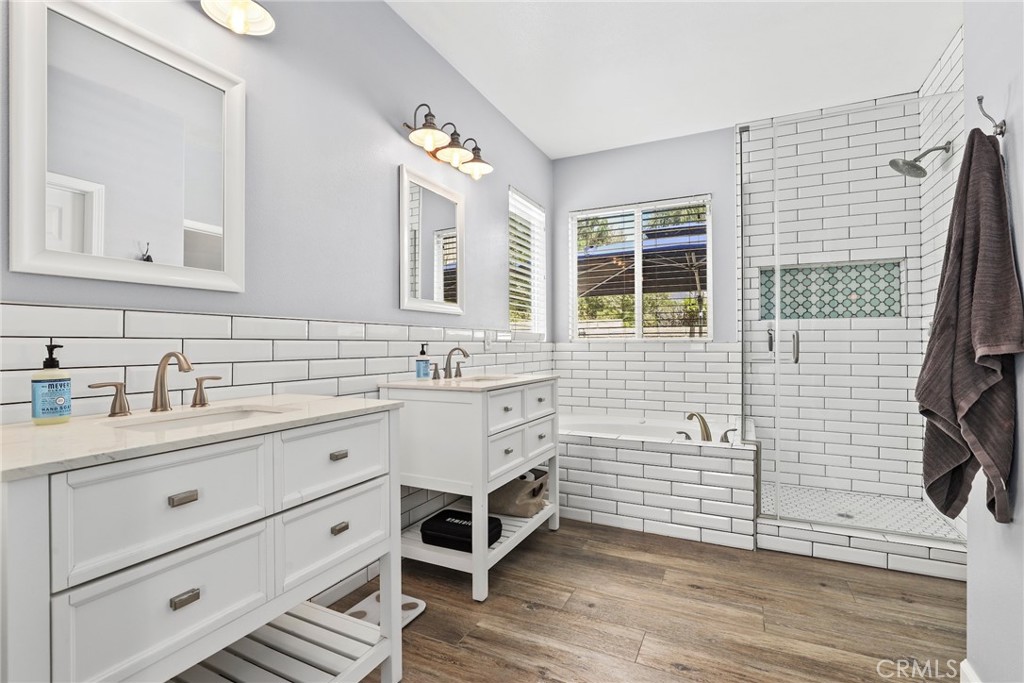 19735 Edmonds Place Saugus, CA 91350 - Photo 19 of 34 a bathroom with a double vanity sink mirror and bathtub