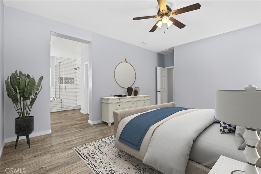 19735 Edmonds Place Saugus, CA 91350 - Photo 20 of 34 a bedroom with a bed and a chandelier