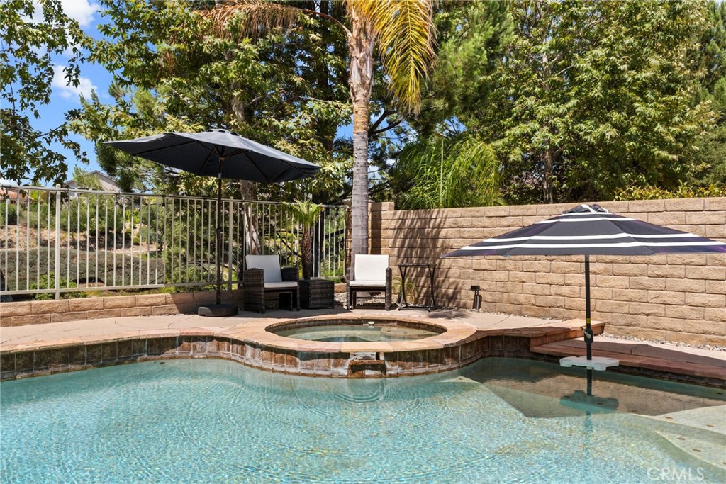 19735 Edmonds Place Saugus, CA 91350 - Photo 22 of 34 a view of a swimming pool with a patio and a yard