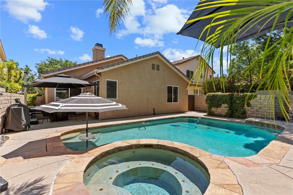 19735 Edmonds Place Saugus, CA 91350 - Photo 23 of 34 a front view of a house with garden