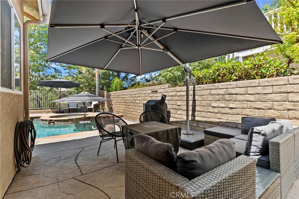 19735 Edmonds Place Saugus, CA 91350 - Photo 25 of 34 a view of a patio with couches under an umbrella