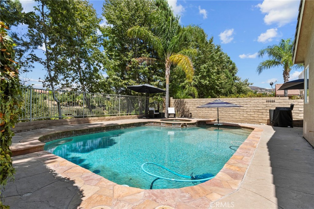 19735 Edmonds Place Saugus, CA 91350 - Photo 26 of 34 a view of a swimming pool with a patio