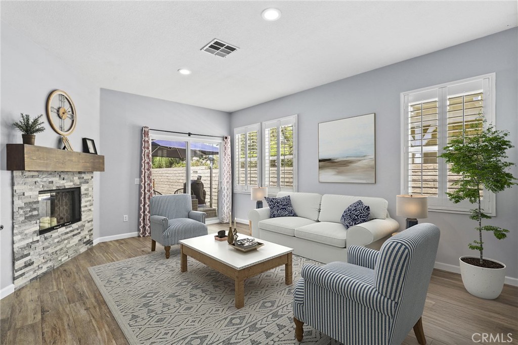 19735 Edmonds Place Saugus, CA 91350 - Photo 7 of 34 a living room with furniture a fireplace and a window