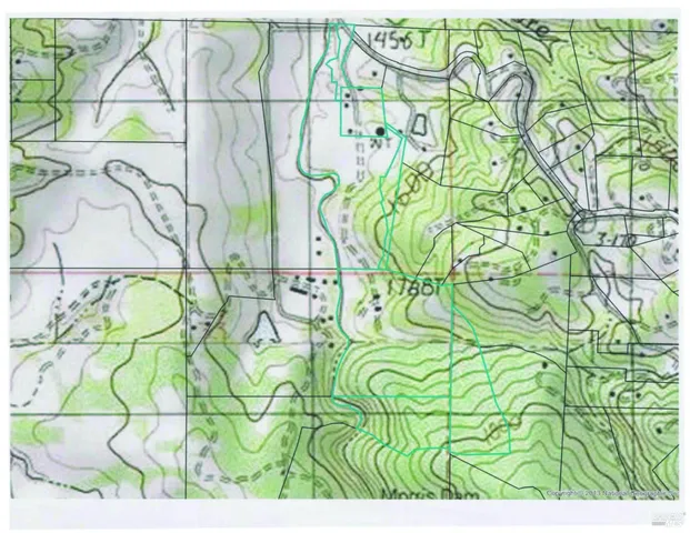 a aerial view of a houses with a yard