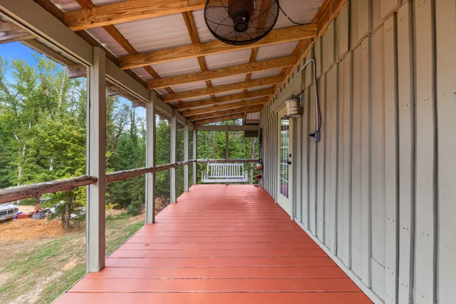 a view of a porch with wooden floor