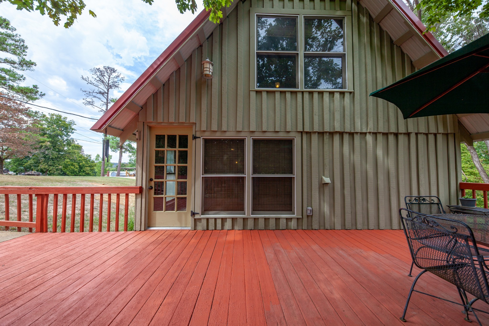 4428 Deer Creek Road Linden, TN 37096 - Photo 16 of 70 a balcony with wooden floor and outdoor space