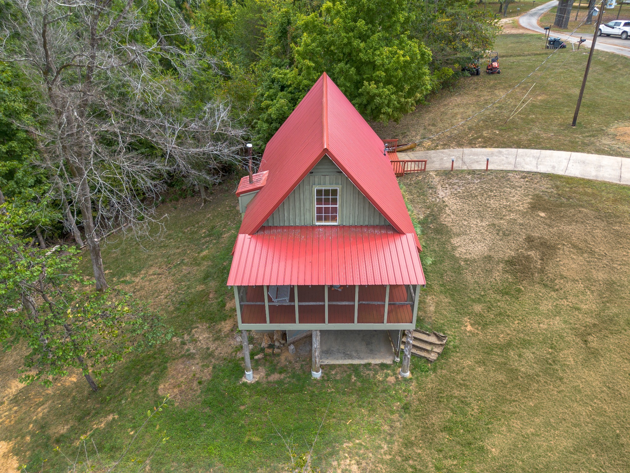 4428 Deer Creek Road Linden, TN 37096 - Photo 17 of 70 a view of a backyard with a garden and entertaining space