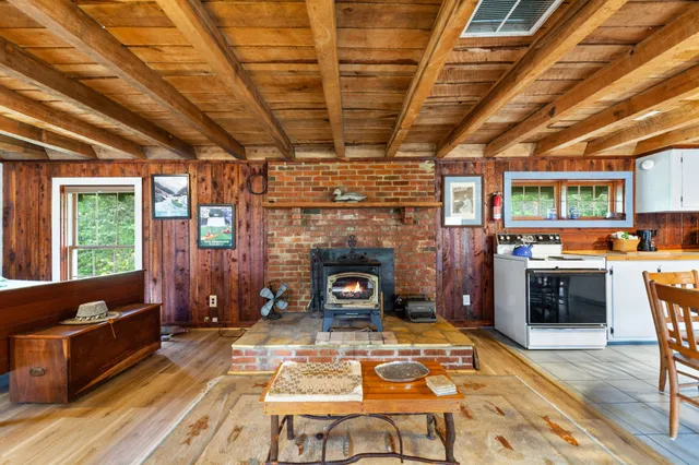 a view of a patio with table and chairs with wooden floor