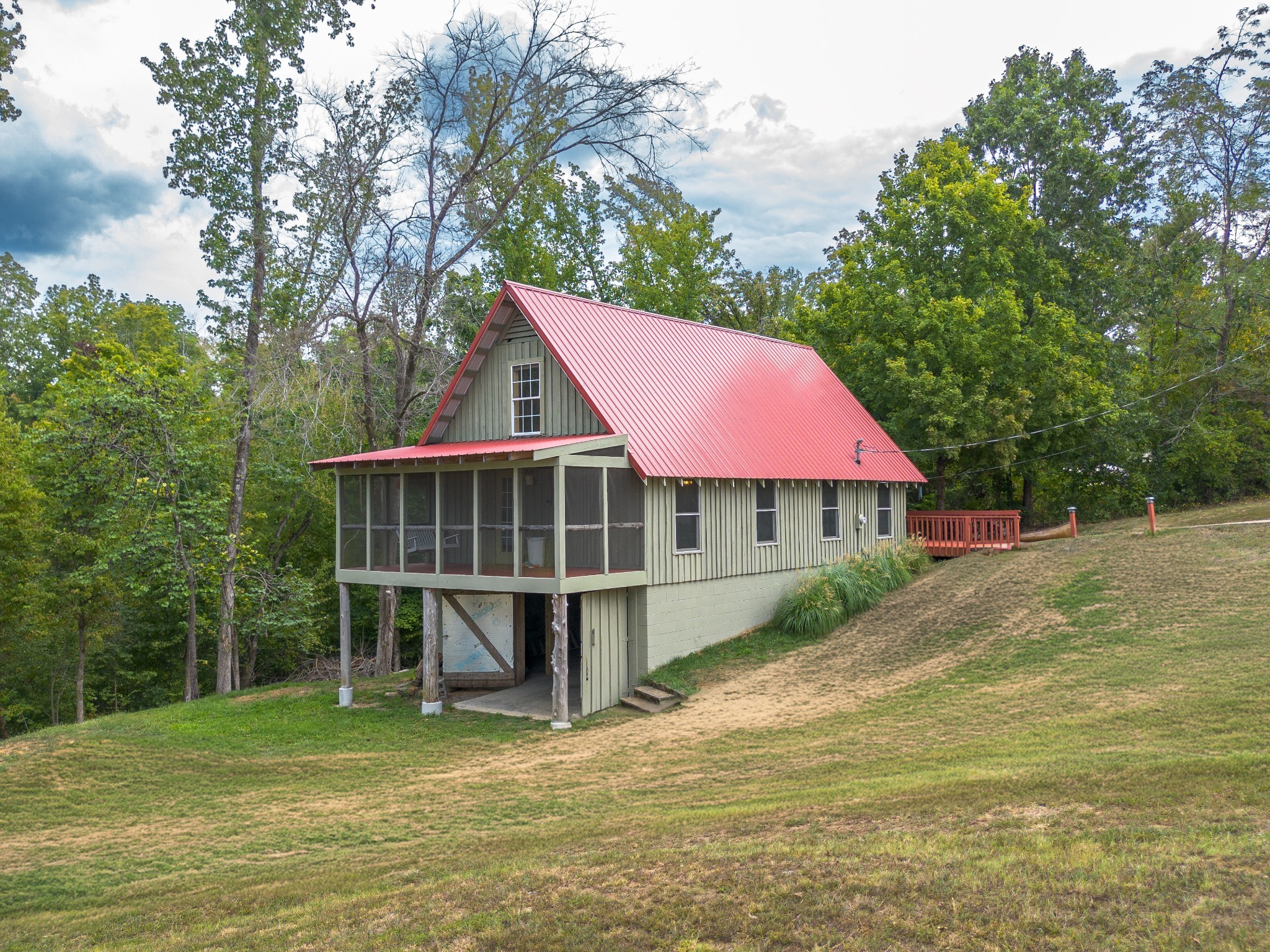 4428 Deer Creek Road Linden, TN 37096 - Photo 3 of 70 a view of a house with backyard porch and furniture