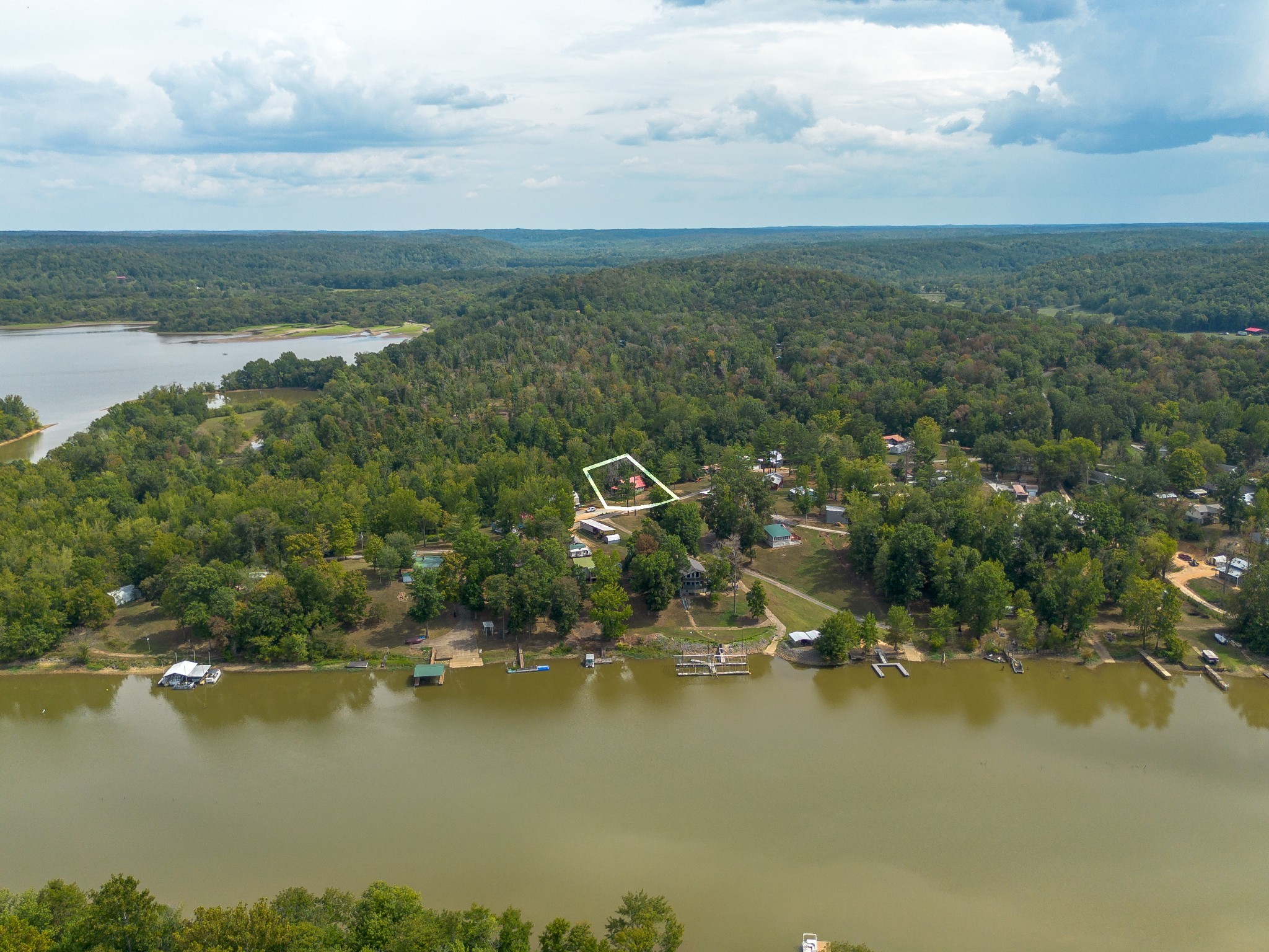 4428 Deer Creek Road Linden, TN 37096 - Photo 52 of 70 an aerial view of residential houses with outdoor space and lake view