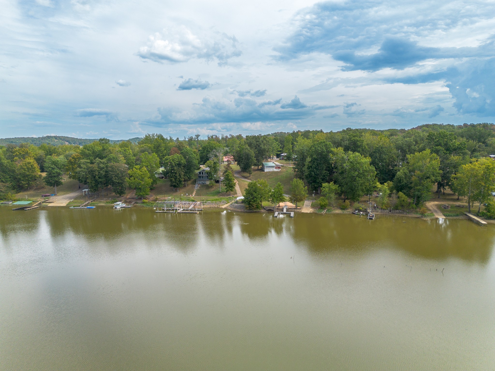 4428 Deer Creek Road Linden, TN 37096 - Photo 54 of 70 a view of a lake with houses in the back
