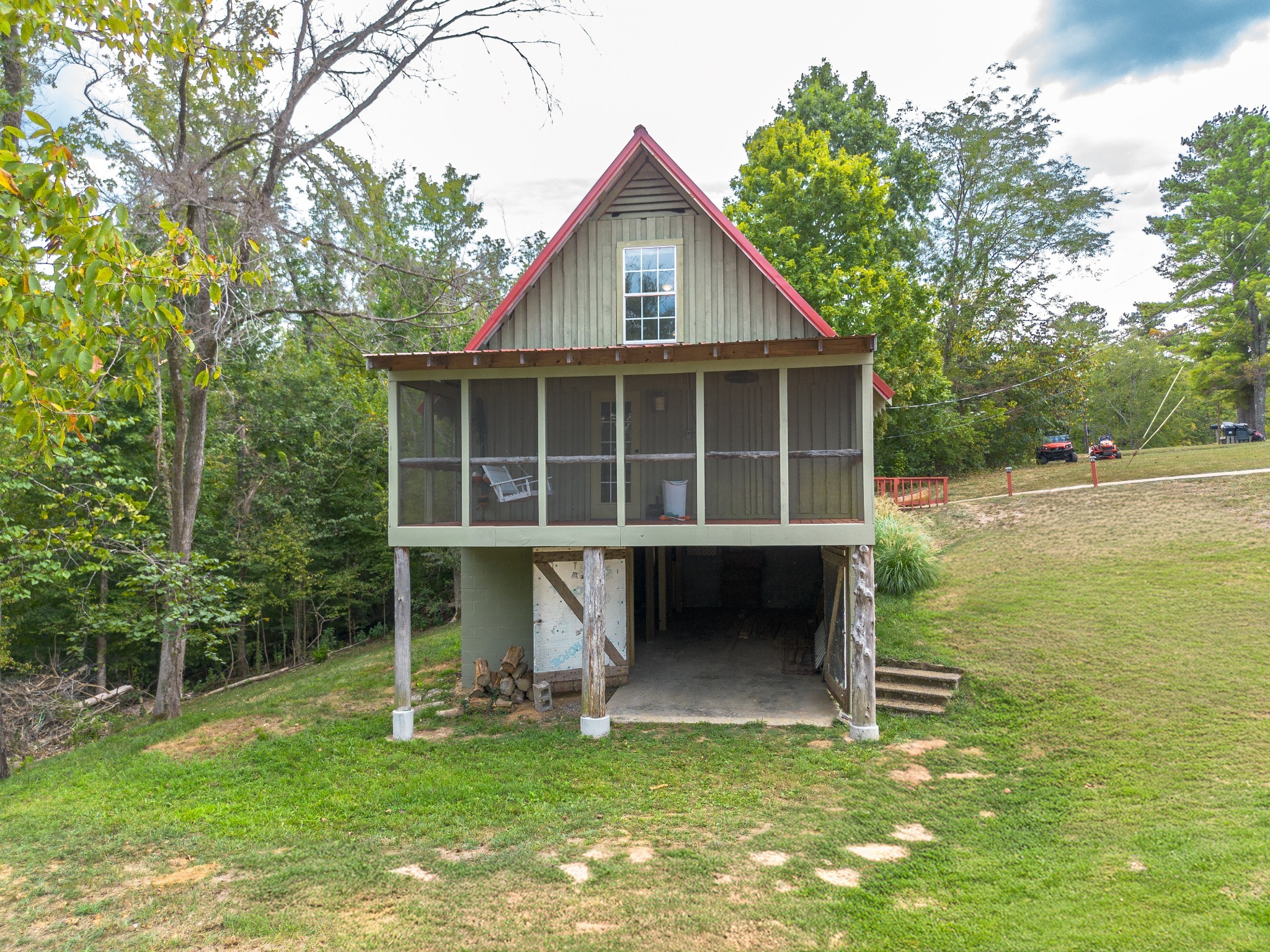 4428 Deer Creek Road Linden, TN 37096 - Photo 9 of 70 a view of a house with a yard and a large tree