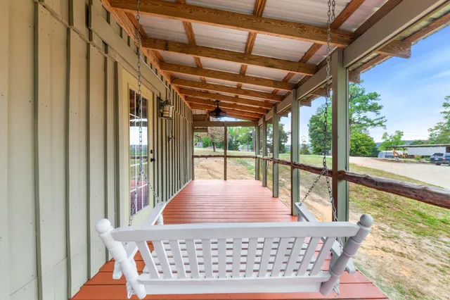 a view of a backyard with a garden and entertaining space