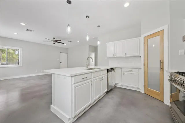 a view of an empty room with a window