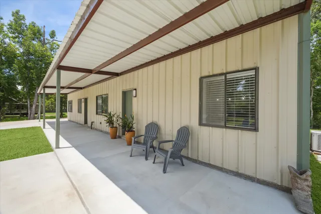 a view of a chair and table on the garden