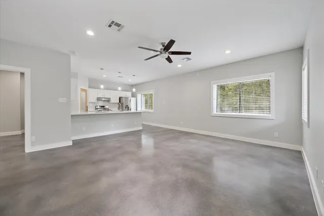 a view of a kitchen with a sink and a window