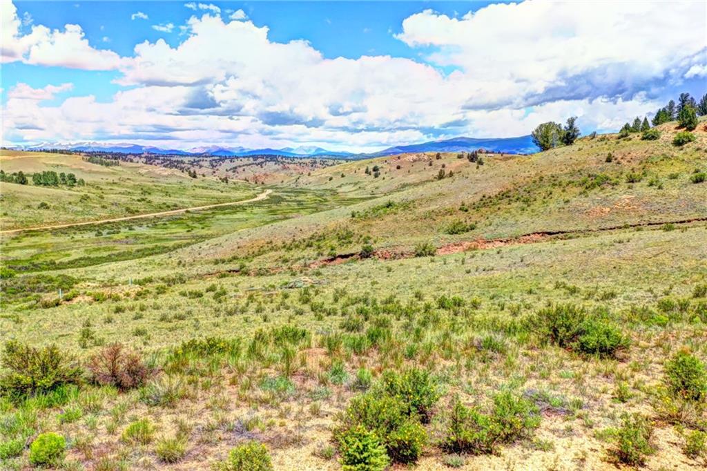 841 Lippzana Road Como, CO 80456 - Photo 7 of 10 a view of a field with mountains in the background