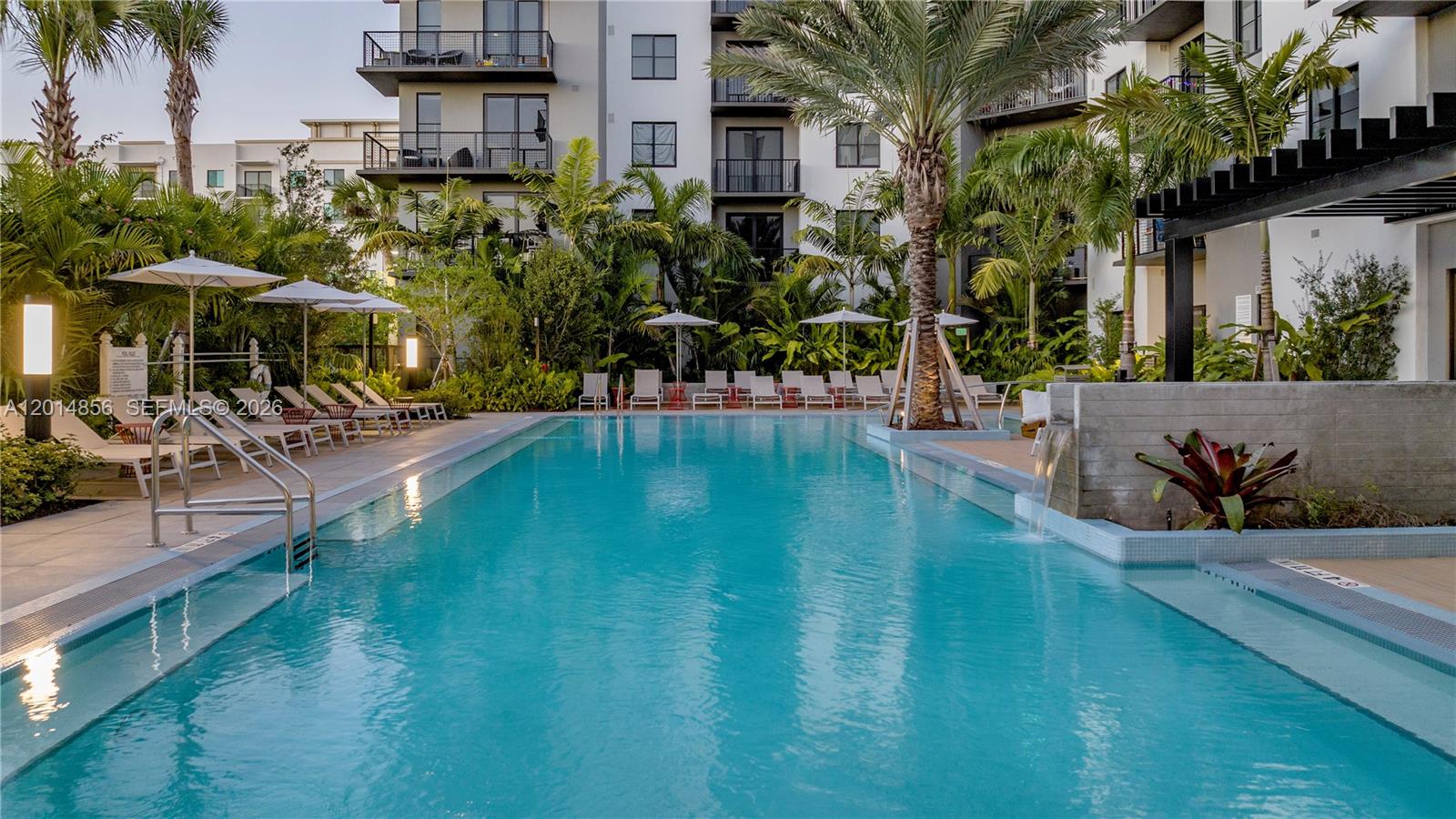 6970 Southwest 40th Street, Unit 228 Miami, FL 33155 - Photo 6 of 22 a view of a swimming pool with a patio