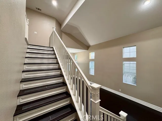 a view of hallway with wooden floor