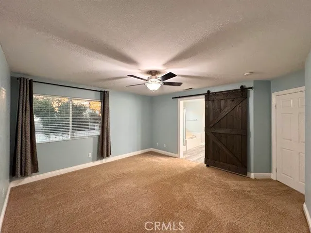 a spacious bathroom with a double vanity sink and a mirror