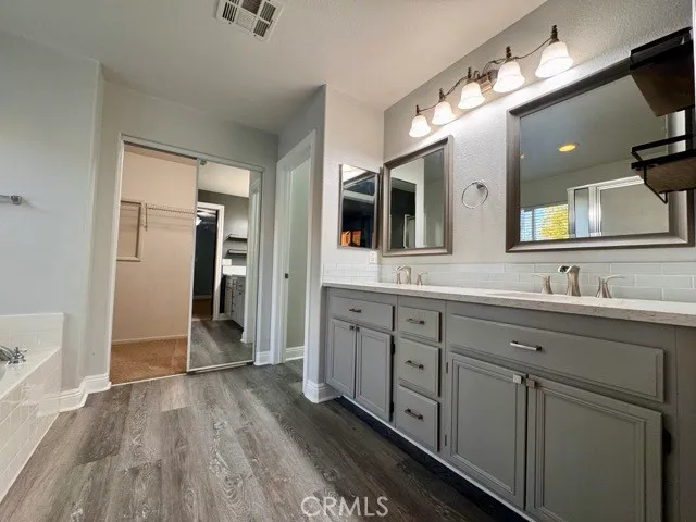 a bathroom with a bathtub and a shower