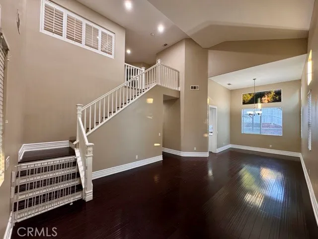 a view of an entryway with wooden floor