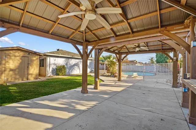 a view of yard with porch and furniture