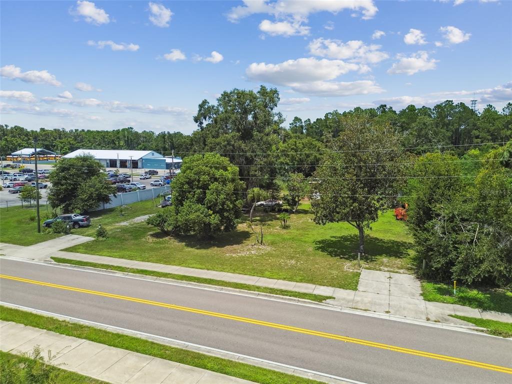 13229 Interlaken Road Odessa, FL 33556 - Photo 6 of 10 a view of a yard in front of a house with a yard