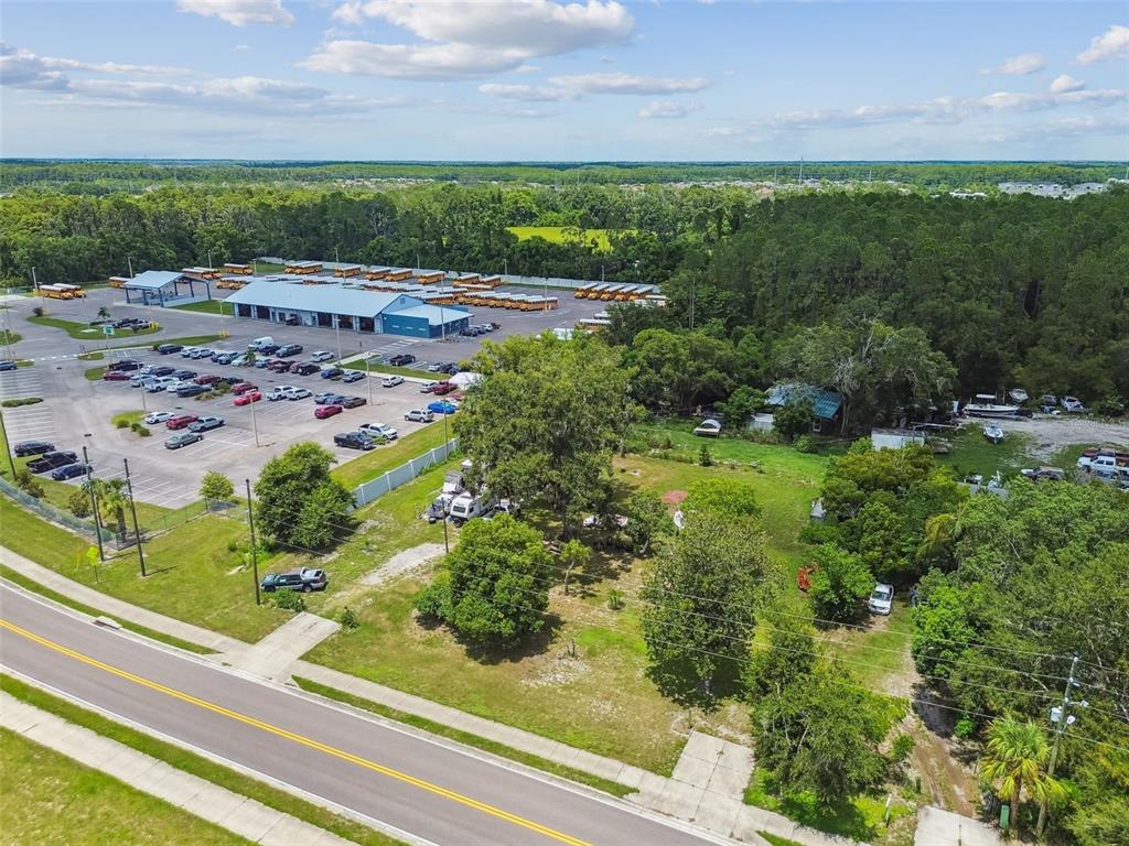 13229 Interlaken Road Odessa, FL 33556 - Photo 9 of 10 a view of a garden with a building in the background